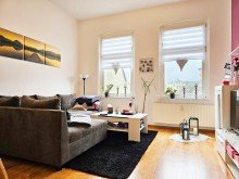 WE4 Wohnzimmer Kapitalanlage mit Zukunft - vollvermietetes Mehrfamilienhaus mit sieben Wohneinheiten